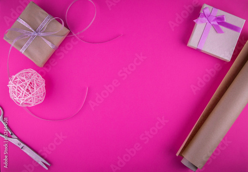 Valentines day gift wrapping on pink background.