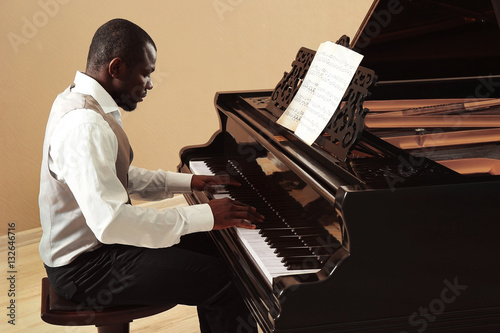 Afro American man playing p...