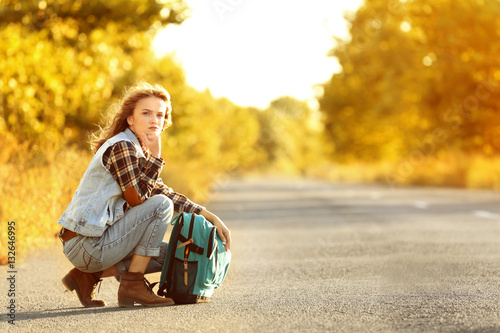 Young woman with backpack o...