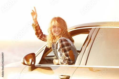 Young female driver in car ...