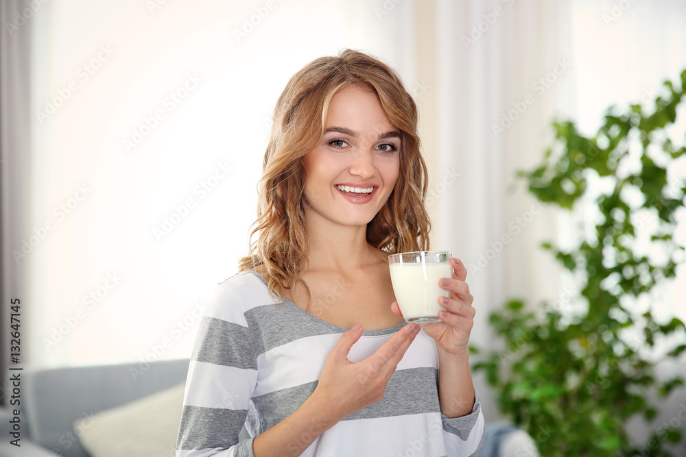 Beautiful young woman with glass of milk Beautiful young woman with glass of milk
