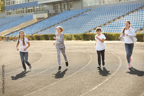 Sporty children running on ...
