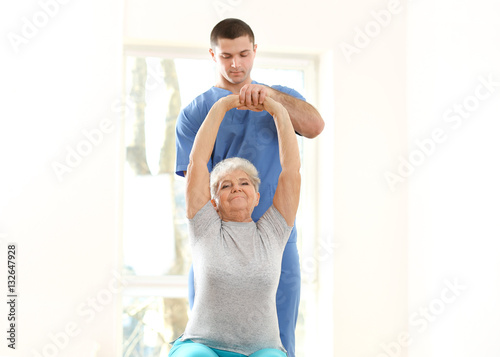 Physiotherapist working wit...