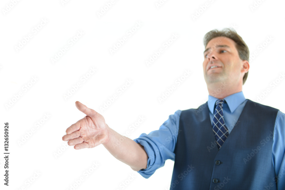 Business or sales man holding out hand for a hand shake with focus on hand Business or sales man holding out hand for a hand shake with focus on hand