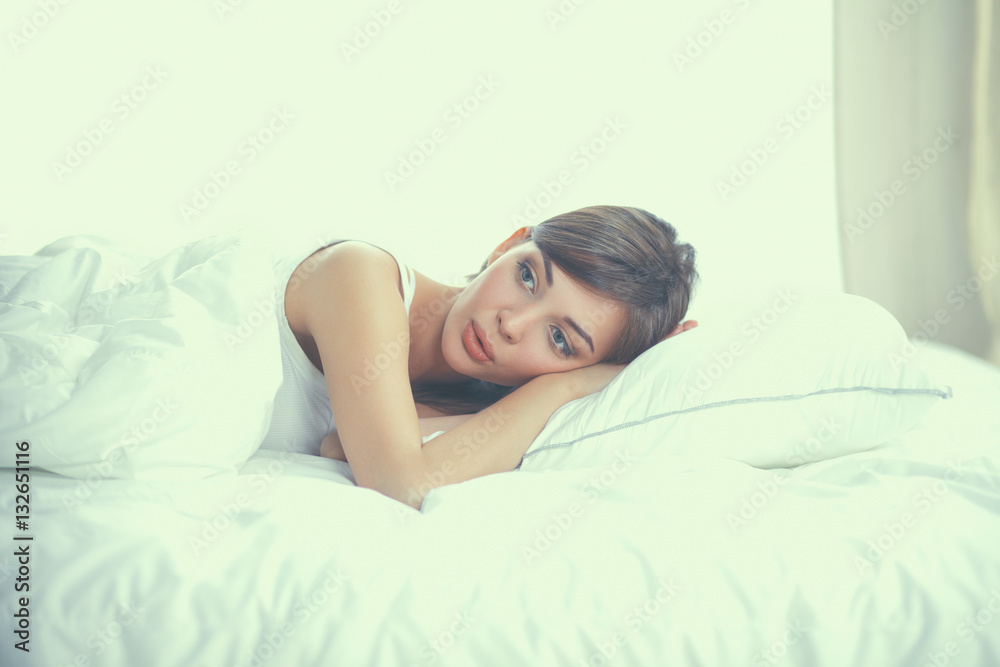Beautiful girl sleeps in the bedroom, lying on bed Beautiful girl sleeps in the bedroom, lying on bed
