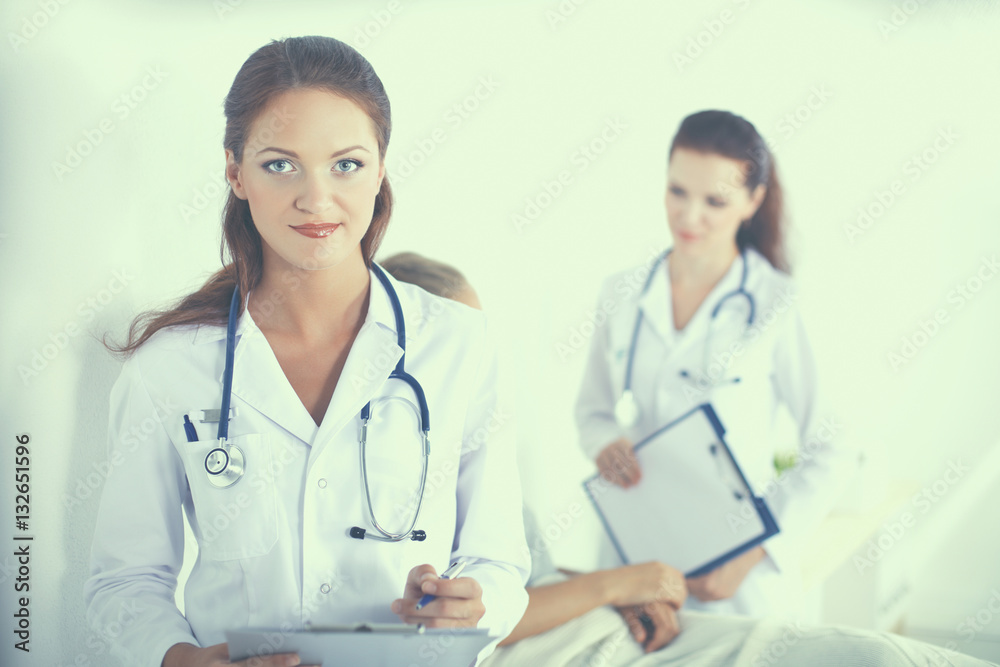 Woman doctor with folder standing at hospital Woman doctor with folder standing at hospital