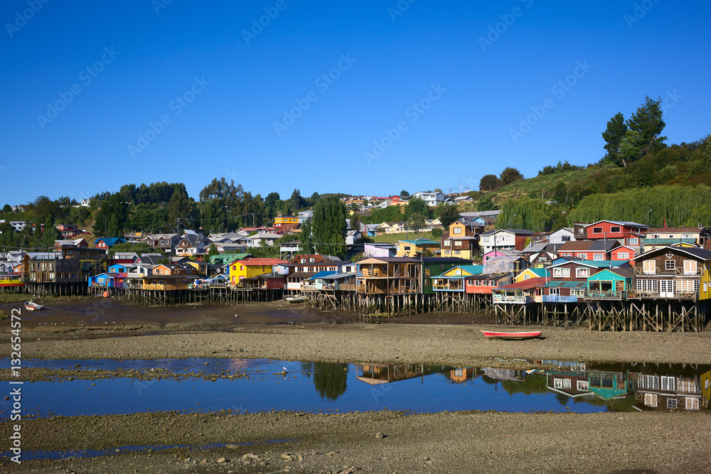 Colorful Palafitos, traditional wooden stilt houses at low tide in Castro, the capital of the Chiloe Archipelago in Chile