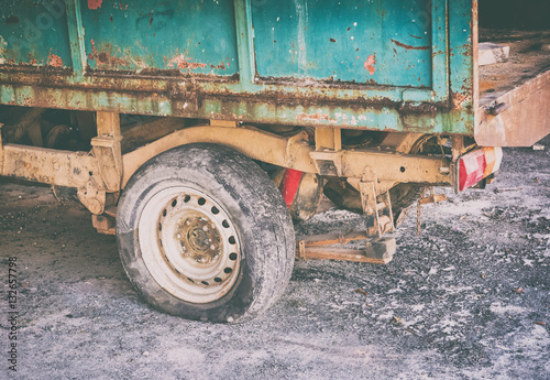 A rusty old junked car tire