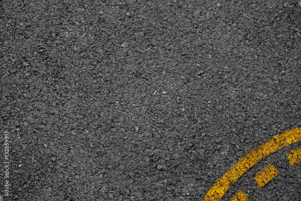 Fototapeta premium Asphalt background texture with some fine grain with Yellow Stri