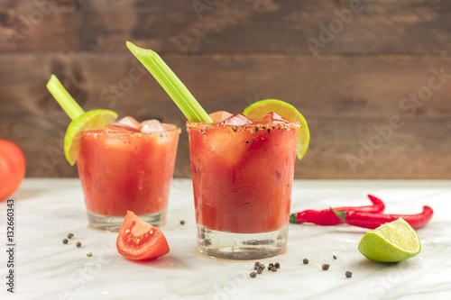 Bloody Mary cocktails with celery and lime