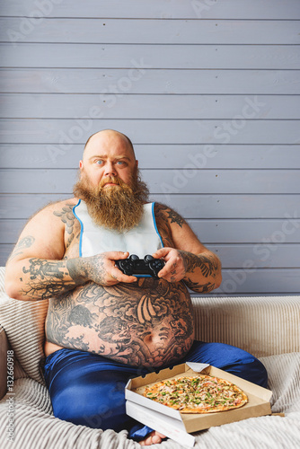Fotografija Man playing video games