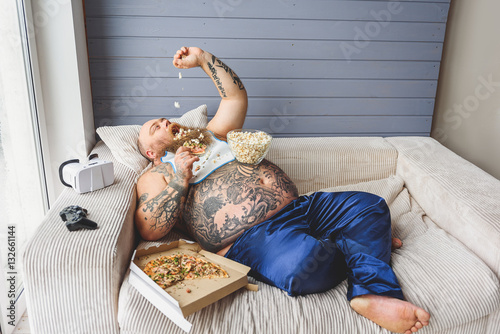 Man eating unhealthy food