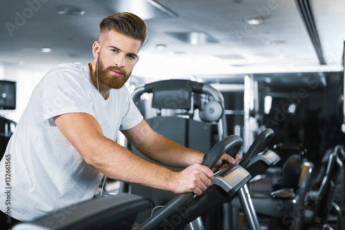 Sporty bearded man in gym