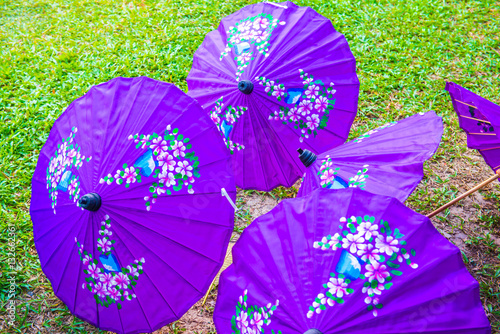 Thai native umbrella on ground photo