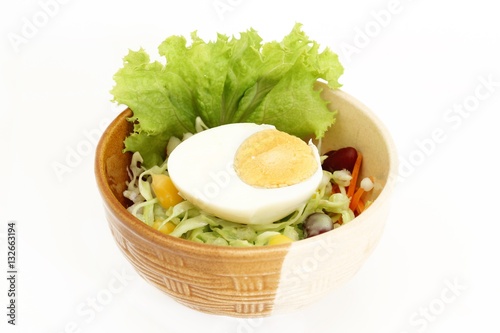 fresh egg with vegetable salad isolated on white background