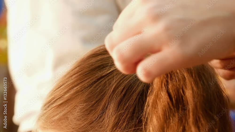 Female model getting her hair dressed before an event. Makeup appearance and hairstyle are important for every beautiful woman. Female model getting her hair dressed before an event. Makeup appearance and hairstyle are important for every beautiful woman.