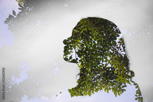 Konstfotografi Double exposer of asian girl with tree background