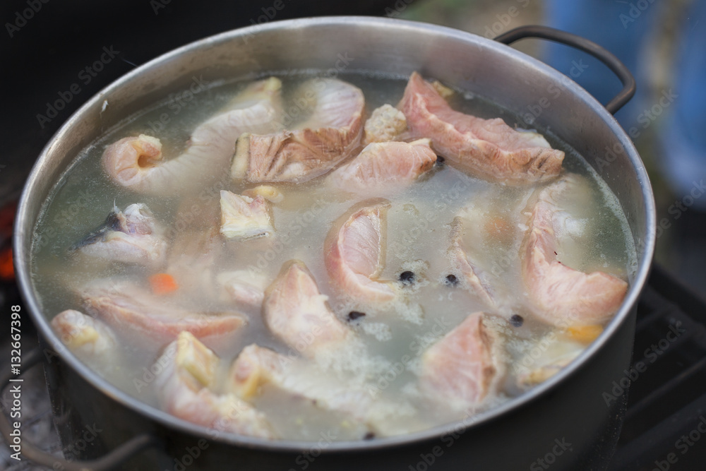 Сauldron with fish soup at outdoor
Сauldron with fish soup at outdoor