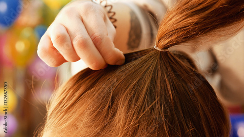 Female model getting her hair dressed