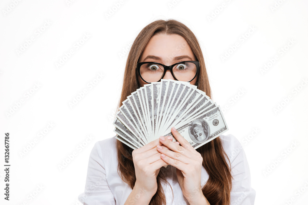 Young woman in formalwear holding paper currency in her hands Young woman in formalwear holding paper currency in her hands
