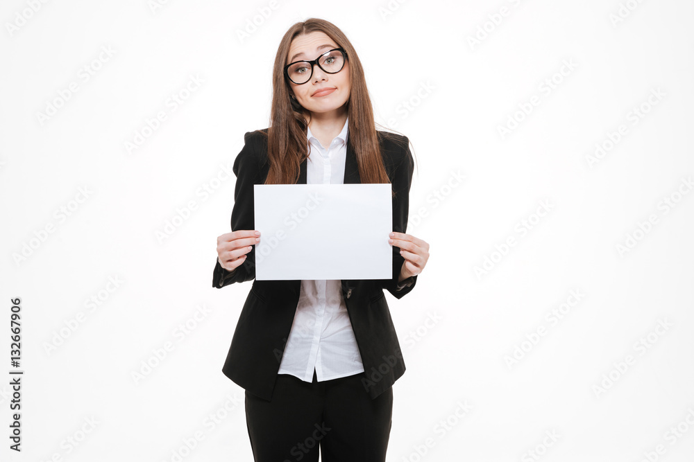 Confused business woman holding blank board and shrugging shoulders Confused business woman holding blank board and shrugging shoulders