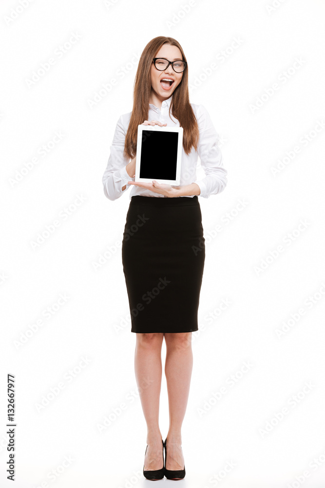 Happy excited business woman showing tablet with blank screen Happy excited business woman showing tablet with blank screen