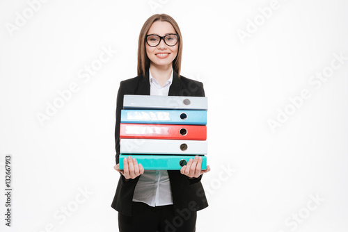 Portrait of a smiling business woman holding folders