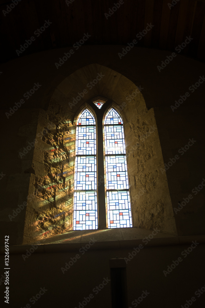 Stained glass window in old chapel. Normandy France