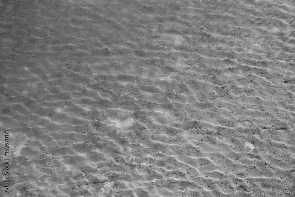 Pond grey water texture with small waves in blank and white. Pond grey water texture with small waves in blank and white.