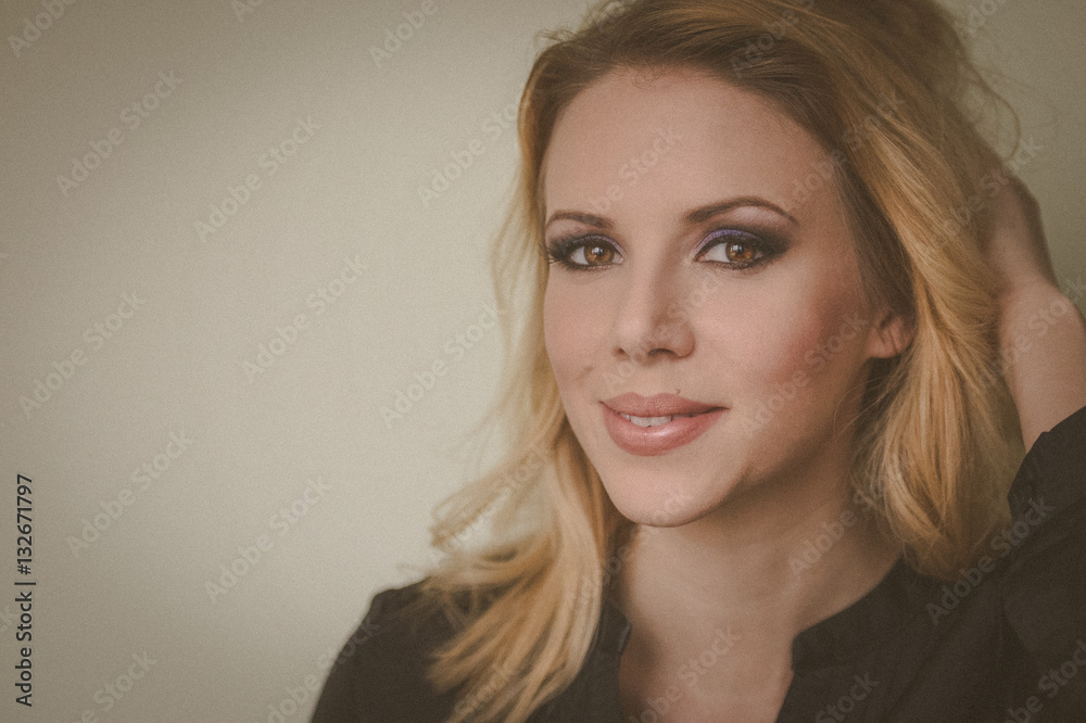 Woman model with professional daily make up on beige background. Woman model with professional daily make up on beige background.