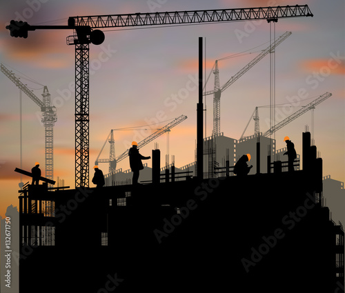 five workers and building cranes at orange sunset