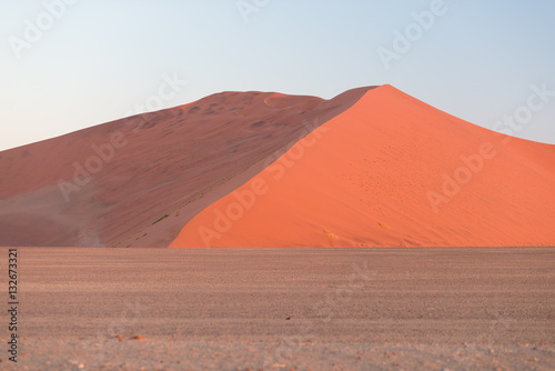 Colorful sunset over the Namib desert  Namibia  Africa. Scenic sand dunes in backlight in the Namib Naukluft National Park  Swakopmund.