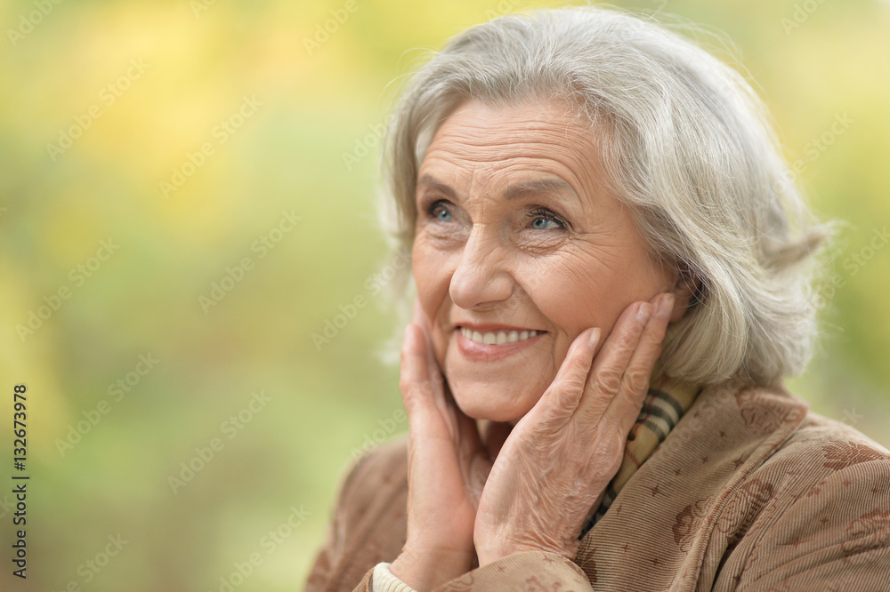 Beautiful middle-aged woman in autumn park Beautiful middle-aged woman in autumn park