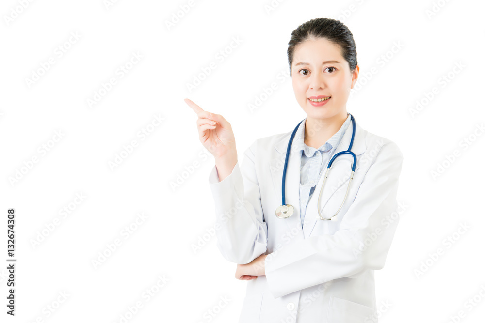 Happy female doctor point gesture blank area or copyspace Happy female doctor point gesture blank area or copyspace