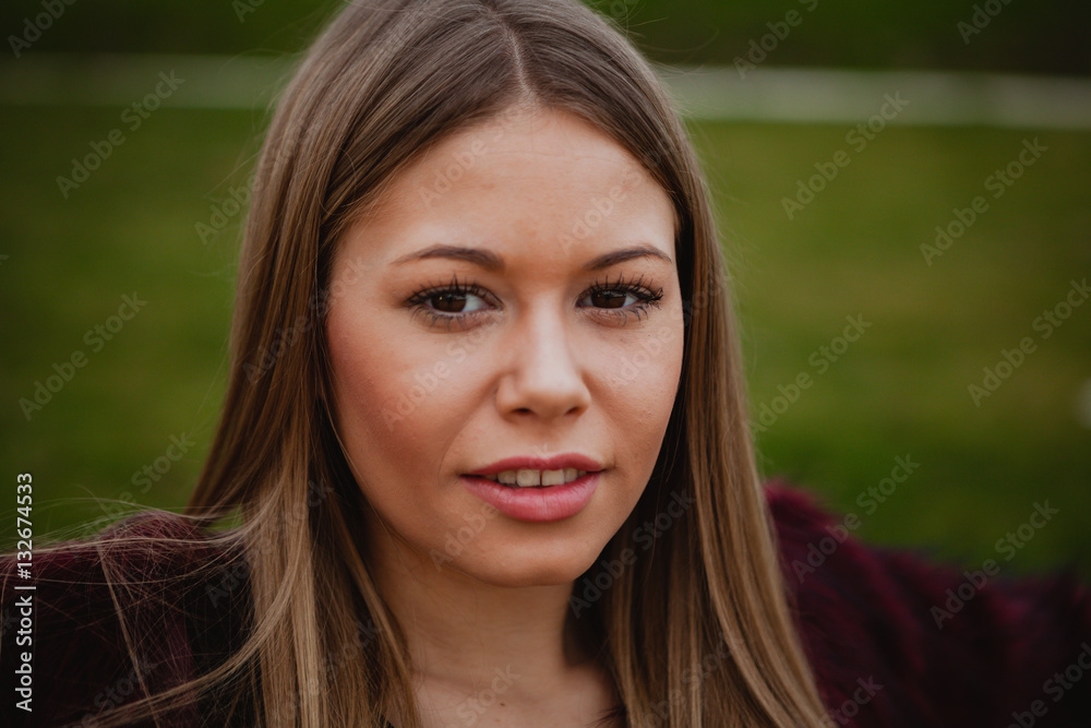 Pretty blonde girl with fur coat