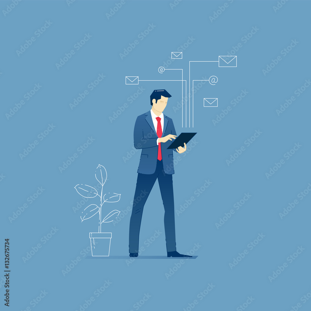 Businessman stands with a tablet PC
