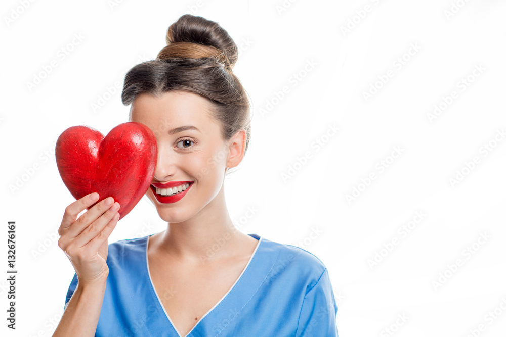 Female cardiologist in uniform holding red heart isolated on the white background Female cardiologist in uniform holding red heart isolated on the white background