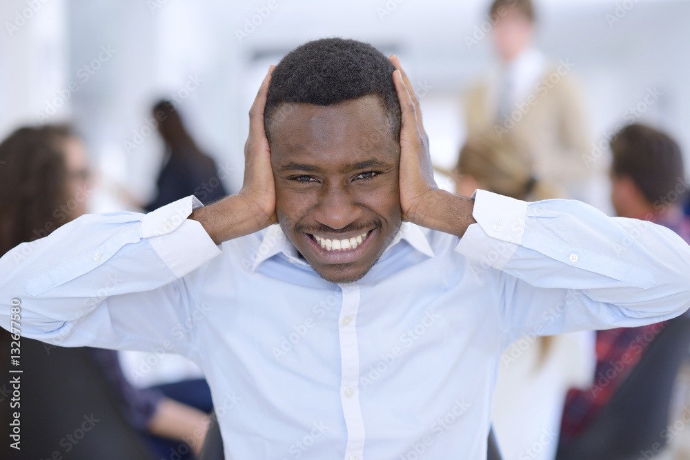 Obraz premium Furious black businessman tired of working on project at office.