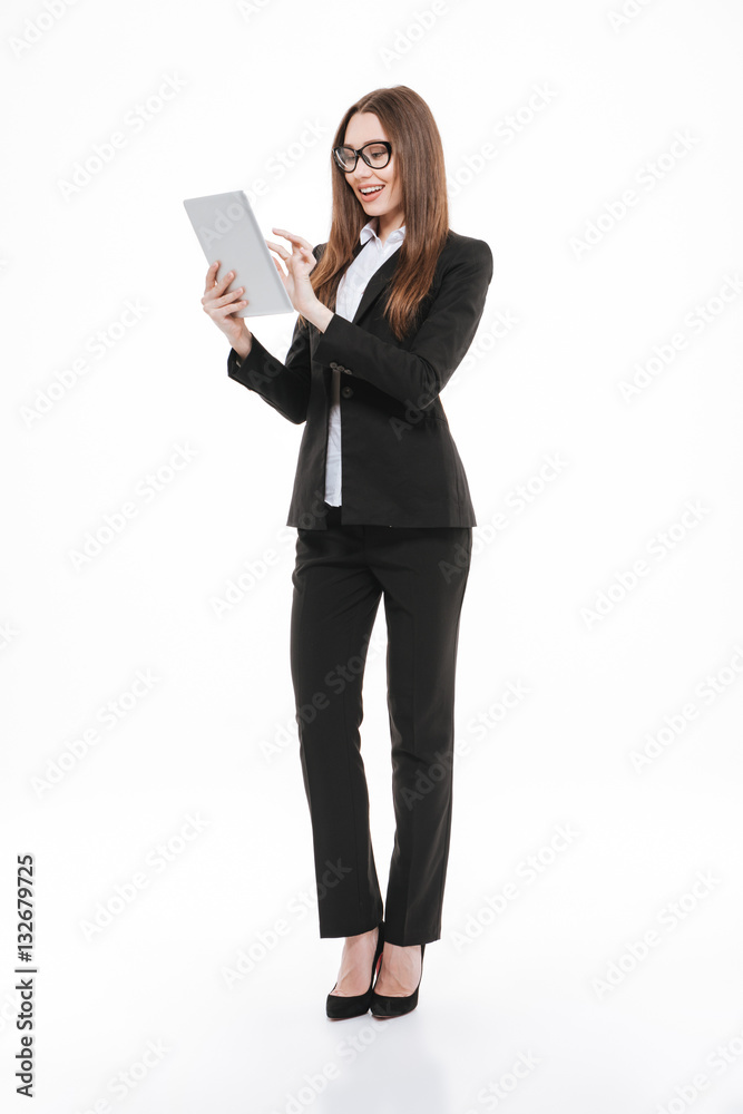 Confident young business woman holding digital tablet Confident young business woman holding digital tablet
