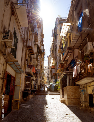Narrow street in old town of Naples city in Italy