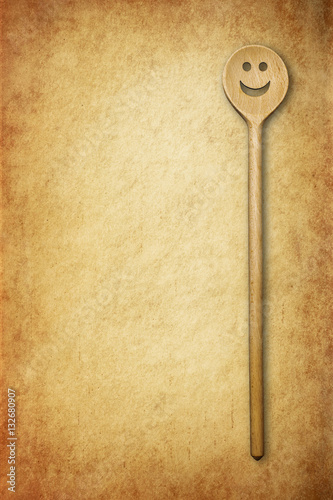 Cooking background - wooden spoon on old grunge vintage background. © fotoyou