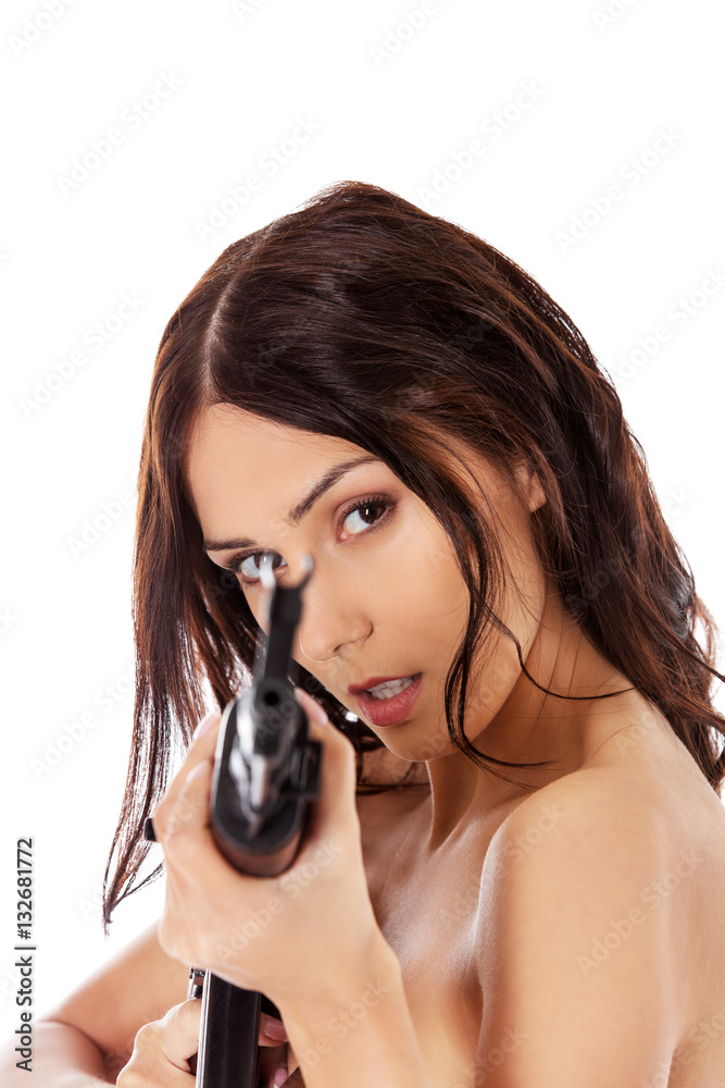 Sexy nude brunette girl model with weapon. Sexy nude brunette girl model with weapon.