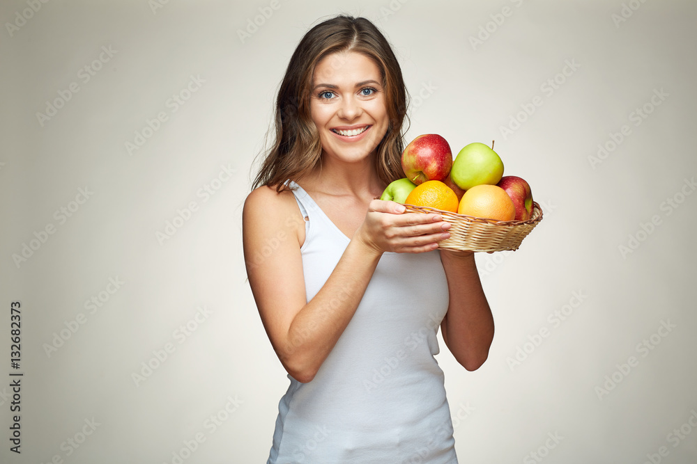 smiling woman holding fruit set. red, green apples. oranges. smiling woman holding fruit set. red, green apples. oranges.