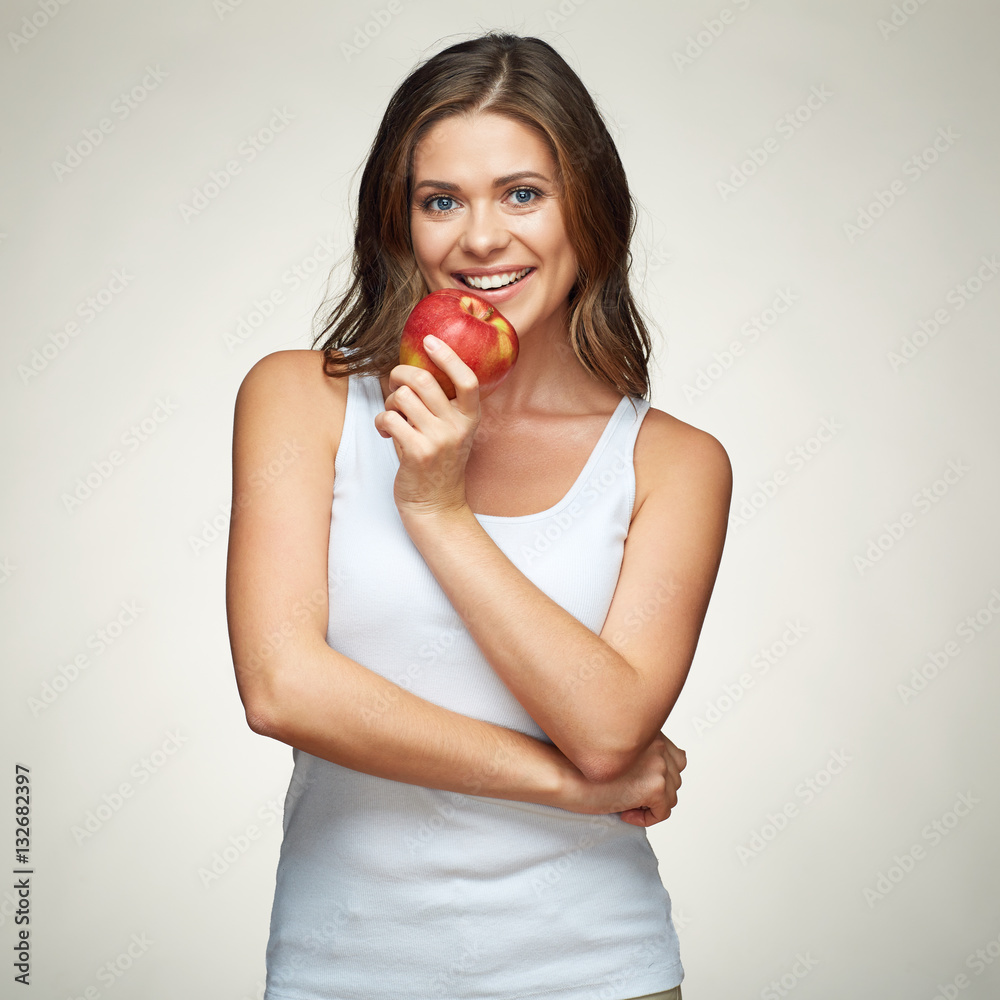 smiling woman bites red apple. smiling woman bites red apple.