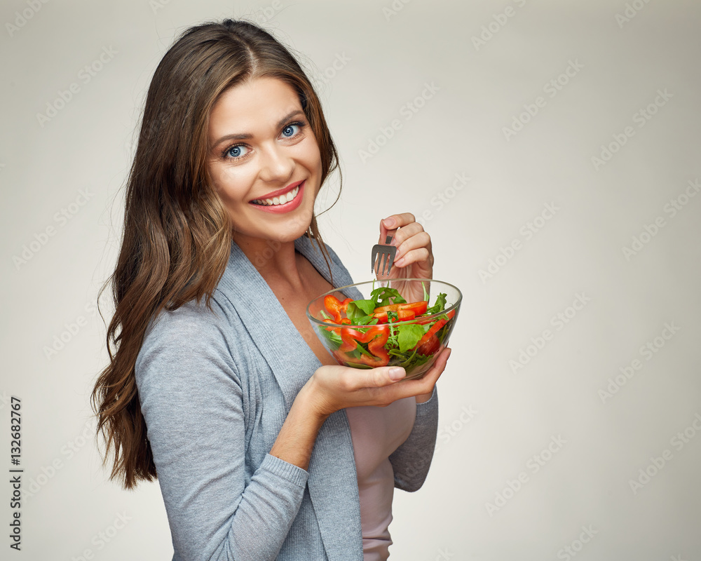 smiling woman eating salad. portrait of beautiful girl smiling woman eating salad. portrait of beautiful girl
