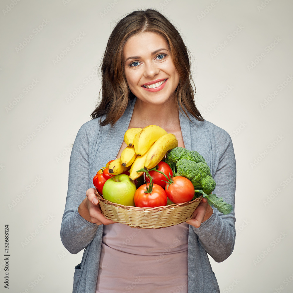 smiling woman hold basket with healthy green food. smiling woman hold basket with healthy green food.
