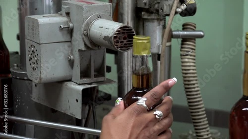 Semi-automatic bottling line in the rum factory. Pinar del Rio, Cuba photo