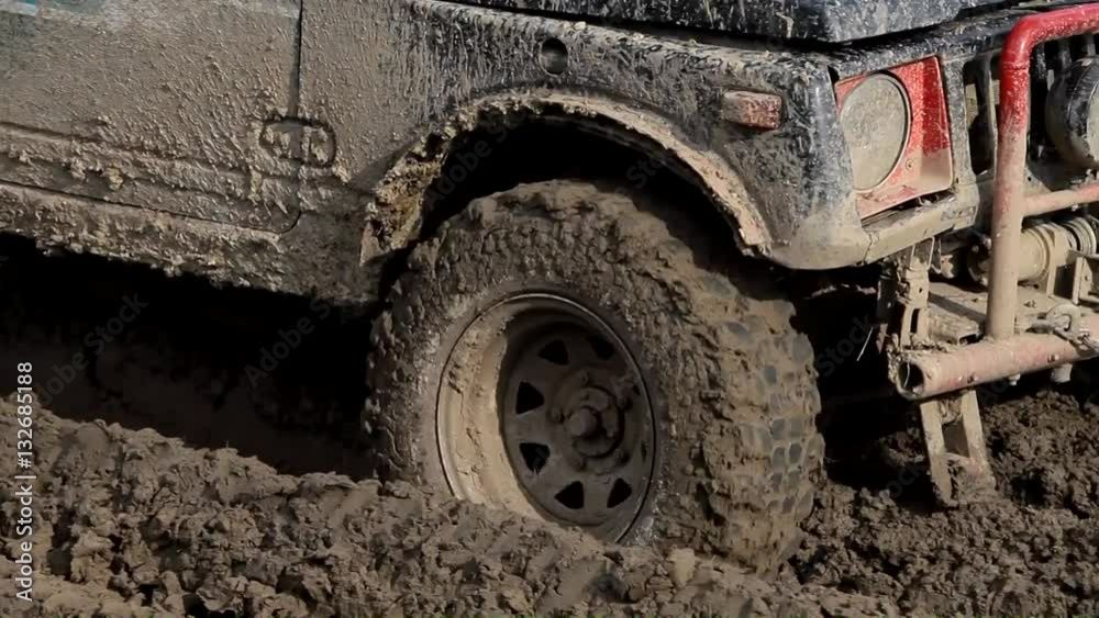 4x4 offroad vehicle is trying to cross the muddy area 4x4 offroad vehicle is trying to cross the muddy area