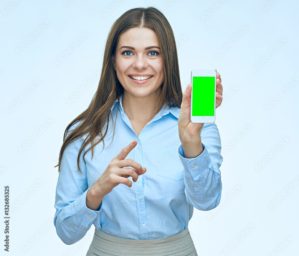 Smiling business woman show screen mobile phone. Pointing finge Smiling business woman show screen mobile phone. Pointing finge