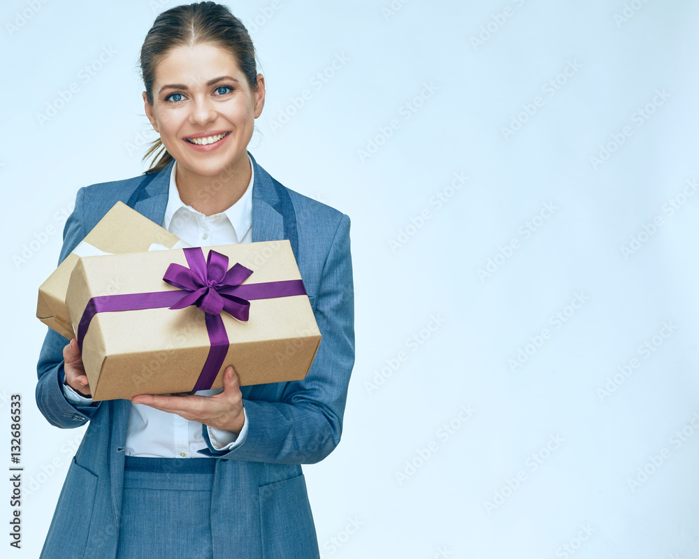 toothy smiling business woman standing with gift box against whi toothy smiling business woman standing with gift box against whi